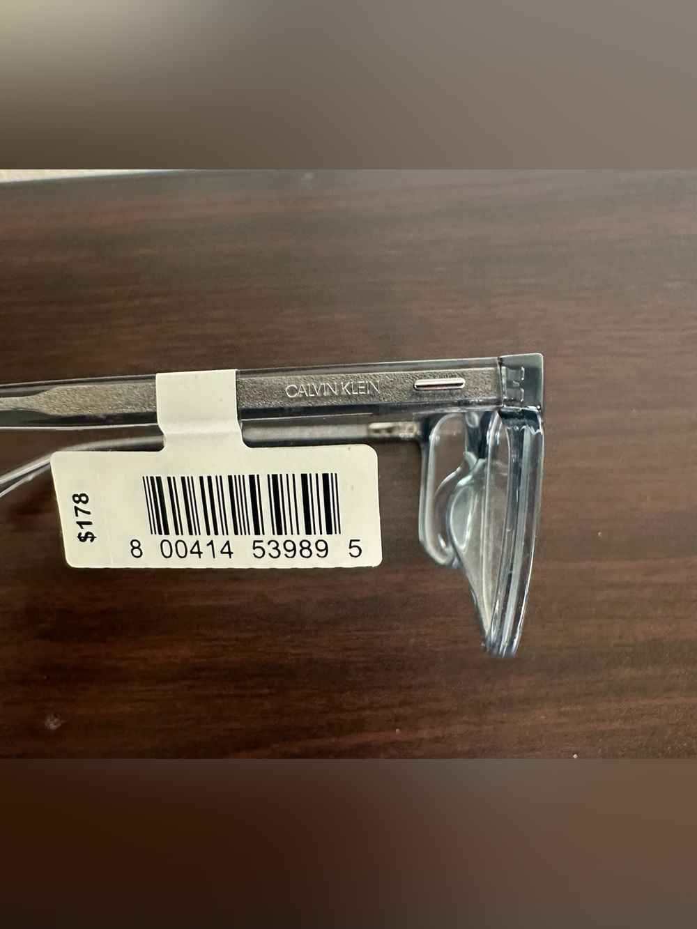 Calvin Klein translucent gray rectangular eyeglasses with silver temples